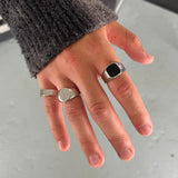 Mens Stainless steel silver signet and band rings for everyday wear. Steel silver polished rings, featuring a onyx signet ring, a polished circle signet ring and a polished band ring for men